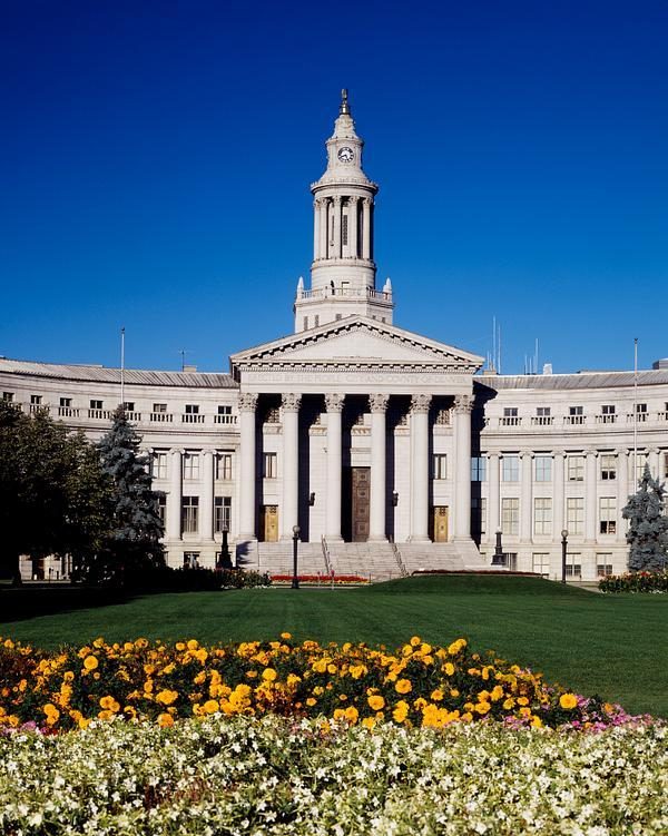 The Denver City and County Building on Bannock Street, flower beds in the foreground